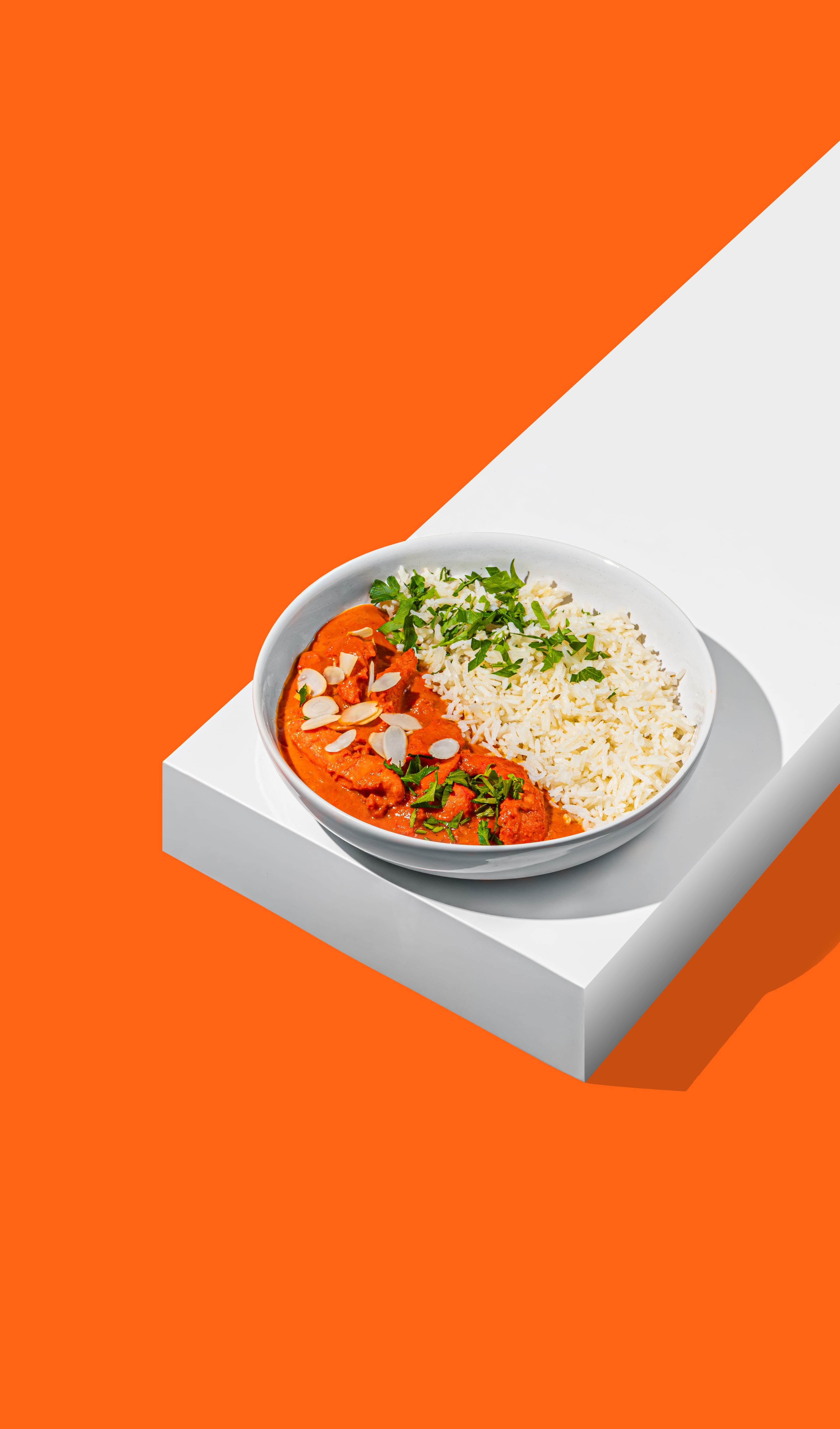 Indisches Curry mit Reis in der Bowl vom AMRIT Lieferservice