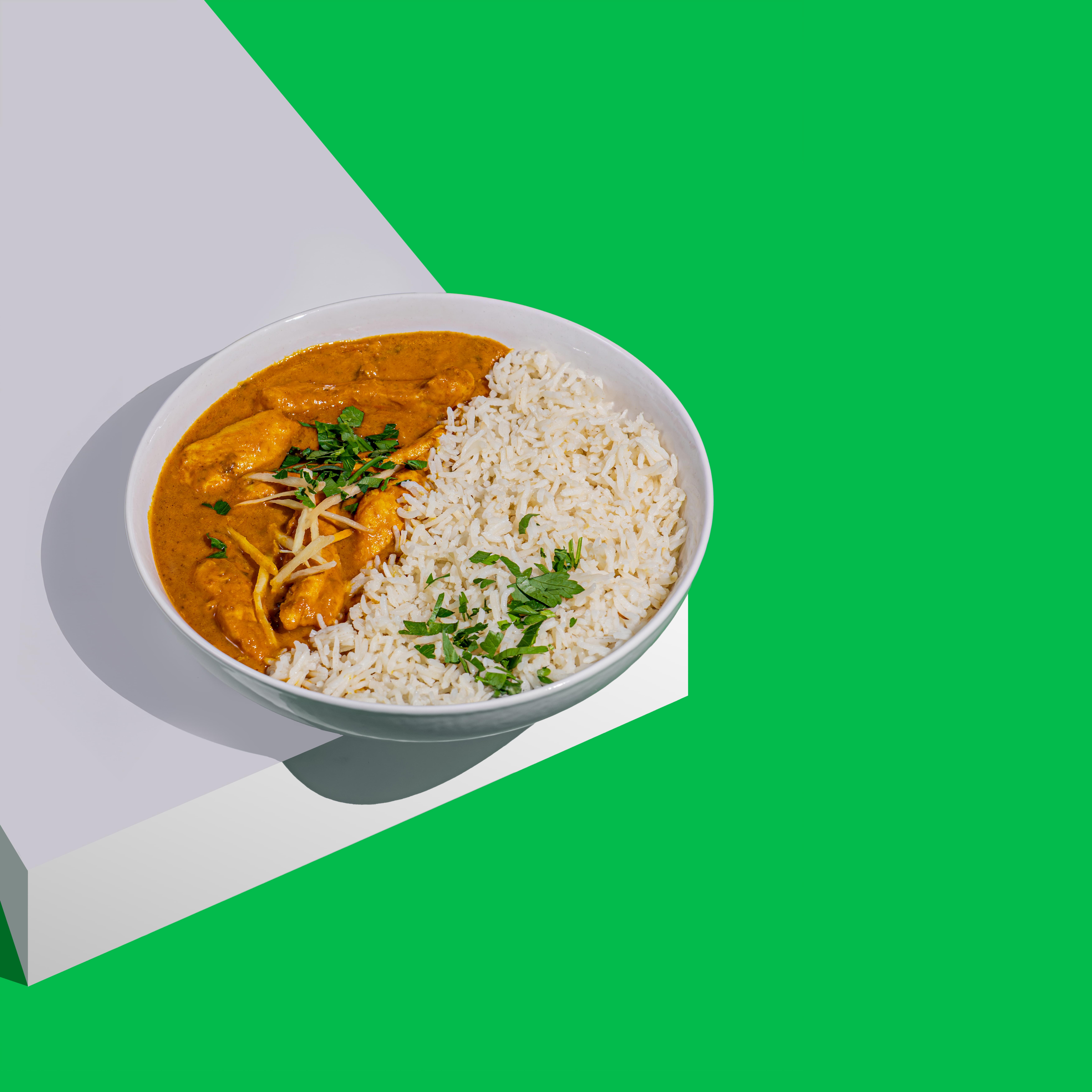 Butter Chicken mit Basmatireis zum Liefern von AMRIT