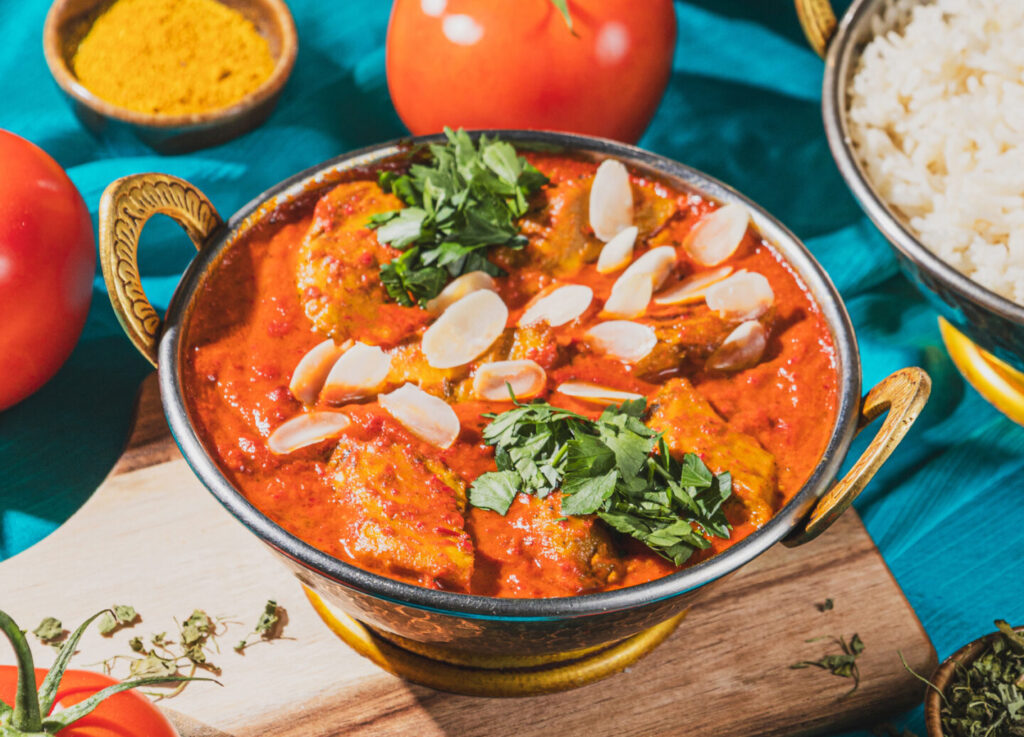 AMRIT vegan - vegan No Butter Chicken in Kupfer Kadai - vegan Planted statt Hähnchen